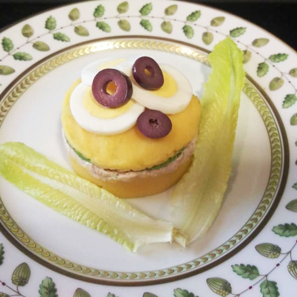 Tuna causa rellena, private chef, Peruvian cuisine, seafood dish, gourmet cuisine, food presentation, culinary creations, luxury dining, fine dining, event catering, event planning.